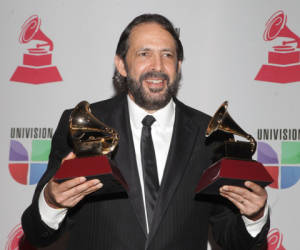 Juan Luis Guerra poses with the trophies for Album of the Year and Producer of the Year at the 13th Annual Latin Grammy Awards on November 15, 2012 in Las Vegas, Nevada. AFP PHOTO/John GURZINSKI