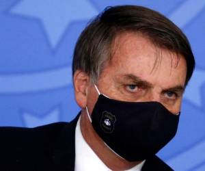 Bolsonaro aboga por la 'vuelta a la normalidad' con argumentos económicos, y promueve el uso de cloroquina e hidroxicloroquina en el tratamiento de la enfermedad. Foto: AP
