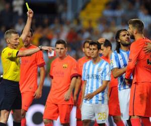 En un duro partido, Málaga logró un 0-0 que amargó al Barcelona. / AFP
