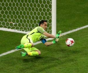 Chile goalkeeper Claudio Bravo make a save in the shoot-out of the Confederations Cup, semifinal soccer match between Portugal and Chile, at the Kazan Arena, Russia, Wednesday, June 28, 2017. (AP Photo/Dmitri Lovetsky)