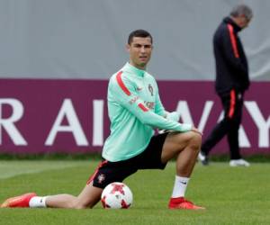 FILE - In this file photo dated Monday, June 26, 2017, Portugal's Cristiano Ronaldo stretches during a training session in St. Petersburg, Russia. Spain's tax authority confirmed Wednesday July 12, 2017, that customs agents have boarded and carried out an inspection of a yacht rented by Portugal soccer captain Cristiano Ronaldo, adding that the inspection targeted the boat's owner, not Ronaldo as its renter. (AP Photo/Dmitri Lovetsky, FILE)