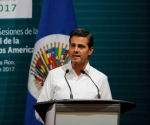 Mexico's President Enrique Pena Nieto speaks during the opening of the 2017 General Assembly of the Organization of American States in Cancun, Mexico, Monday, June 19, 2017. Venezuela's foreign minister walked out of a meeting of regional diplomats to discuss the South American country's political crisis on Monday as a 17-year-old anti-government demonstrator was shot and killed during clashes with security forces. The OAS meeting once again narrowly failed to approve a resolution that would have pushed back against some of Venezuelan President Nicolas Maduro's most radical actions.(AP Photo/Israel Leal)