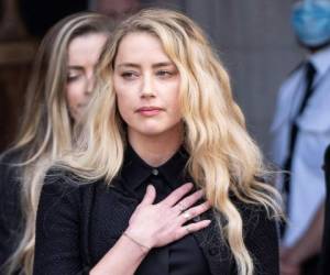 Amber Heard aseguró que no presentó una demanda contra su exesposo porque no quería atravesar por este duro momento. Foto: AFP