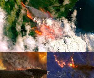 A plane drops fire retardent to protect a property during an operation to douse bushfires in Penrose, in Australia's New South Wales state on January 10, 2020. - High temperatures and strong winds were expected to fan massive bushfires blazing across southeastern Australia on January 10, as authorities issued new emergency warnings after several days of cooler conditions brought some reprieve to affected communities. (Photo by SAEED KHAN / AFP)