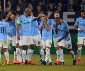 Jugadores del Manchester City en el terreno de juego durante un partido contra el Schalke.