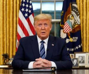 US President Donald Trump addresses the Nation from the Oval Office about the widening novel coronavirus (Covid-19) crisis in Washington, DC on March 11, 2020. - President Donald Trump will makes a primetime address on the coronavirus (Covid-19) crisis, his latest attempt to counter criticism of his response to the growing health and economic fallout from the pandemic. (Photo by Doug Mills / POOL / AFP)