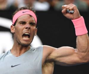 Spain's Rafael Nadal reacts after a point against Argentina's Diego Schwartzman during their men's singles fourth round match on day seven of the Australian Open tennis tournament in Melbourne on January 21, 2018. / AFP PHOTO / WILLIAM WEST / -- IMAGE RESTRICTED TO EDITORIAL USE - STRICTLY NO COMMERCIAL USE --