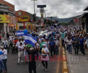 Militantes del partido nacional realizaron nuevamente un marcha en apoyo al presidente Juan Orlando Hernández. Fotos: Marvin Salgado/ El Heraldo Honduras.