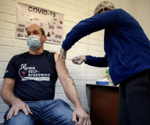 Professor Francois Venter (L) receives an experimental vaccine for COVID-19 coronavirus at the Respiratory & Meningeal Pathogens Research Unit Research Unit (RMPRU), at Chris Hani Baragwanath Hospital in Soweto on July 14, 2020. - Six senior clinicians in the Faculty of Health Sciences at Wits University have volunteered to participate in South Africas first COVID-19 vaccine trial. (Photo by Luca Sola / AFP)