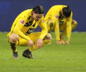 Los jugadores de Dortmund reaccionan después del partido de fútbol de la Bundesliga de primera división alemana Eintracht Frankfurt vs BVB Borussia Dortmund, en Frankfurt, Alemania occidental, el 5 de diciembre de 2020. Foto: AFP