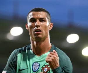 Portugal's Cristiano Ronaldo, right, reacts with Andre Silva, left, after scoring during World Cup Group B qualifying match between Latvia and Portugal at the Skonto Stadium in Riga, Latvia, Friday, June 9, 2017. (AP Photo/Roman Koksarov)