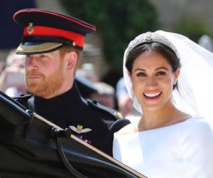 En esta fotografía de archivo del sábado 19 de mayo de 2018, el príncipe Harry y su esposa Meghan Markle salen después de su boda en el Castillo de Windsor, cerca de Londres, Inglaterra.