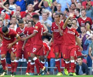 Los jugadores de Liverpool celebran el triunfo ante el Arsenal (Foto: Agencia AFP)