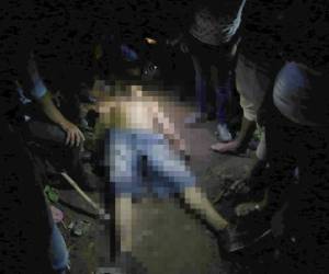 El cadáver de José Reinaldo López alias Dos caras presentaba varias heridas de bala que recibió en un ataque perpetrado por sujetos desconocidos, foto: Johny Magallanes/El Heraldo.