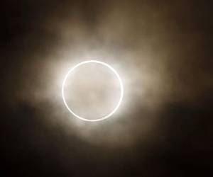 FILE - In this May 21, 2012 file photo, the moon slides across the sun, showing a blazing halo of light, during an annular eclipse at a waterfront park in Yokohama, near Tokyo. The first solar eclipse of the year happens Tuesday, April 29, 2014, and will be visible to skygazers in Antarctica, Australia, and the southern Indian Ocean. The eclipse Tuesday is a rare type of annular eclipse, meaning the sun will appear as a ring around the moon. (AP Photo/Shuji Kajiyama, File)