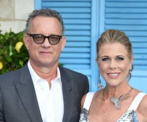 (FILES) In this file photo Tom Hanks and Rita Wilson pose on the red carpet upon arrival for the world premiere of the film 'Mamma Mia! Here We Go Again' in London on July 16, 2018. - Tom Hanks and his wife Rita Wilson have both tested positive for coronavirus, the US actor said Wednesday. Hanks, 63, said he and Wilson came down with a fever while in Australia, and will now be isolated and monitored. (Photo by Anthony HARVEY / AFP)