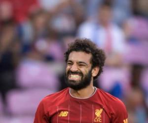 El mediocampista egipcio del Liverpool Mohamed Salah reacciona durante un partido amistoso de fútbol internacional. Foto: Agencia AFP