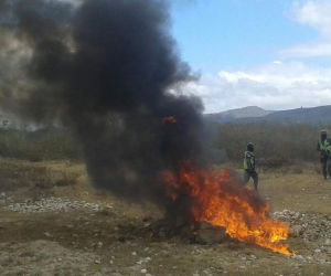 Members of Honduras' Technical Bureau for Criminal Investigation (ATIC) prepare to burn some 250k of cocaine, seized last May, on July 24, 2020 in Tegucigalpa. (Photo by ORLANDO SIERRA / AFP)