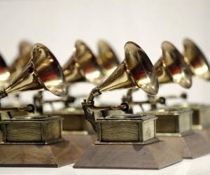 FILE - In this Oct. 10, 2017, file photo, various Grammy Awards are displayed at the Grammy Museum Experience at Prudential Center in Newark, N.J. Nominations for the 61st annual Grammy Awards will be announced Friday morning, Dec. 7, 2018. The Recording Academy delayed unveiling the nominees by two days because former President George H.W. Bush's funeral and public viewing this week in Washington. (AP Photo/Julio Cortez, File)