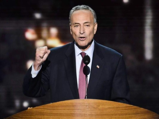 US Senate Minority Leader Chuck Schumer, Democrat of New York, speaks during a press conference at the US Capitol in Washington, DC, January 6, 2021. - Donald Trump faced one of the darkest days of his presidency Wednesday with the US Congress poised to certify Joe Biden's White House victory and Democrats on track to take control of the Senate with a pair of stunning upset victories in Georgia. (Photo by SAUL LOEB / AFP)