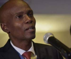 (FILES) In this file photo former Haitian President Jovenel Moise speaks at the swearing in ceremony for Prime Minister Jack Guy Lafontant at the National Palace in Port-au-Prince on February 24, 2017. - The assassins on July 7, 2021 of Haiti's president were 'professional' mercenaries who disguised themselves as US agents and may have already left the country, Haiti's ambassador to the United States said. 'It was a well-orchestrated attack and those were professionals,' Ambassador Bocchit Edmond told reporters. 'We have a video and we believe that those are mercenaries.' (Photo by Pierre Michel Jean / AFP)