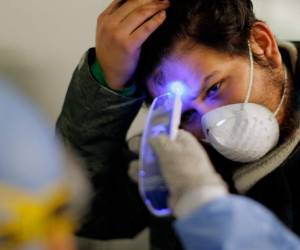 TOPSHOT - A homeless is pictured at a shelter set up at the bicentennial Acho Bullring in Lima for the duration of the novel coronavirus, COVID-19, pandemic, on March 31, 2020. - Located in the populous district of Rimac, near the historic centre of the Peruvian capital, the shelter is expected to give temporary home to up to 150 people. (Photo by Cris BOURONCLE / AFP)