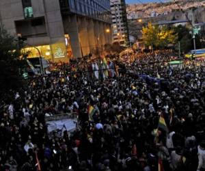 Supporters of Bolivian president Evo Morales gather at San Francisco square their support as the opposition disputes results announced by the electoral court on Monday that suggested an outright Morales victory in the first round of the presidential election held on the weekend, in La Paz on October 23, 2019. - Bolivia's opposition launched a general strike on Wednesday amid protests and disturbances over disputed election results that pointed to another term for President Evo Morales, who linked the stoppage to a right wing coup. (Photo by Aizar RALDES / AFP)