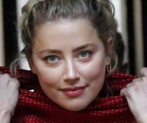 La actriz estadounidense Amber Heard llega al Tribunal Supremo en Londres para declarar en el juicio por la demanda de su exposo, Johnny Depp, contra un tabloide británico que lo tildó en un artículo de 'marido golpeador'. Depp niega todas las acusaciones. (AP Foto/Frank Augstein).