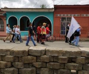 Las protestas iniciaron el 18 de abril contra una reforma a la seguridad social, pero tras las muertes de jóvenes en las marchas, se ampliaron para exigir la renuncia de Ortega. Foto AP