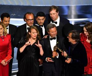 Coda cast and crew accept the award for Best Picture for CODA onstage during the 94th Oscars at the Dolby Theatre in Hollywood, California on March 27, 2022. (Photo by Robyn Beck / AFP)