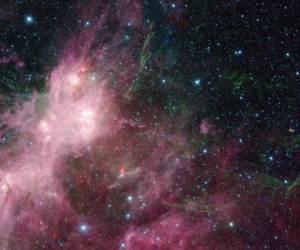 Imagen proporcionada por NASA de datos infrarrojos tomados del telescopio especial Spitzer y el Explorador Infrarrojo de Campo Amplio en una zona en donde se forman estrellas conocidas como W3 y W5 dentro de la galaxia Vía Láctea. Foto: AP.