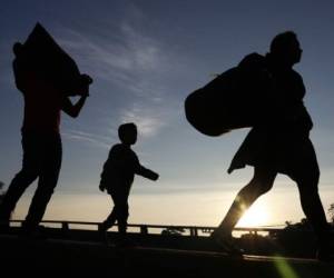 El hondureño de 22 años salió del país con un menor de edad que no era su hijo. Foto: Archivo AFP.