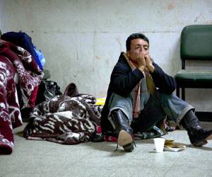 A relative of an injured person sits on the floor of a public hospital in the town of San Marcos, northern Guatemala, Wednesday, Nov. 7, 2012. A 7.4 magnitude earthquake caused dozens of dead and many missing Wednesday in San Marcos, some 80 miles (130 kilometers) from the epicenter.(AP Photo/Moises Castillo)
