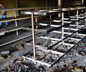 Vista de daños en un supermercado en Valencia, Estado de Carabobo (Foto: Agencia AFP)