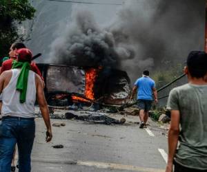 El Ministerio Público reportó también 437 lesionados y 1.289 personas aprendidas por diversos disturbios y saqueos . Foto: AFP