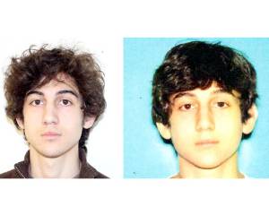 This combo of undated images released by the FBI (L) and the Boston Police Department (R) shows Marathon bombing suspect Dzhokhar Tsarnaev, who is the subject of an April 19, 2013 manhunt in the Boston area. One of the Boston marathon bombing suspects was killed in a shootout early April 19 as police raced on a house-to-house search for Tsarnaev, with the entire city placed on lockdown. The two men believed to be responsible for Monday's deadly carnage at the finish line of the prestigious race are reportedly brothers of Chechen origin who were permanent legal residents of the United States. == RESTRICTED TO EDITORIAL USE / MANDATORY CREDIT: 'AFP PHOTO / FBI / BOSTON POLICE DEPARTMENT / NO SALES / NO MARKETING / NO ADVERTISING CAMPAIGNS / DISTRIBUTED AS A SERVICE TO CLIENTS ==
