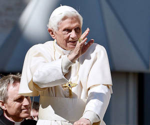 (FILES) Paolo Gabriele (Bottom L), the pope's butler, sits in the popemobilenext to Pope Benedict XVI as they arrive in St. Petr's square on April 18, 2012 for the pope's weekly general audience. Vatican police arrested the pope's butler on May 25, 2012, on allegations of having leaked confidential documents and letters from the pontiff's private study to the newspapers, Italian media reported.The Vatican said it has arrested a man caught in possession of secret documents in a bid to crack down on the source of the leak scandal, but would not confirm the suspect's identity, age, or when he had been arrested. AFP PHOTO / VINCENZO PINTO