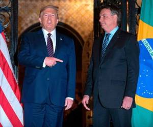 El presidente estadounidense Donald Trump junto a Jair Bolsonaro, líder de Brasil. Foto: Agencia AFP.