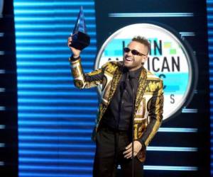 HOLLYWOOD, CA - OCTOBER 25: Nacho accepts the Favorite Tropical Song award for 'Bailame' onstage during the 2018 Latin American Music Awards at Dolby Theatre on October 25, 2018 in Hollywood, California. Rich Fury/Getty Images/AFP== FOR NEWSPAPERS, INTERNET, TELCOS & TELEVISION USE ONLY ==