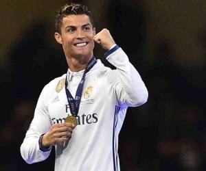 Real Madrid's Cristiano Ronaldo celebrates after Real Madrid won the UEFA Champions League final football match between Juventus and Real Madrid at The Principality Stadium in Cardiff, south Wales, on June 3, 2017. / AFP PHOTO / Glyn KIRK