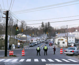 NEWTOWN, CT - DECEMBER 15: Police officers stand at the entrance to the street leading to the Sandy Hook Elementary School on December 15, 2012 in Newtown, Connecticut. Twenty six people were shot dead, including twenty children, after a gunman identified as Adam Lanza opened fire in the school. Lanza also reportedly had committed suicide at the scene. A 28th person, believed to be Nancy Lanza was found dead in a house in town, was also believed to have been shot by Adam Lanza. Spencer Platt/Getty Images/AFP== FOR NEWSPAPERS, INTERNET, TELCOS & TELEVISION USE ONLY ==