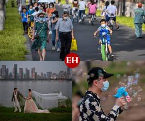 Imágenes de boda, paseos en el lago y en biclicletas reflejan que la vida vuelve despacio a Wuhan, la ciudad china donde surgió la epidemia del coronavirus. A pesar del desconfinamiento, habrá que esperar para recuperar completamente la normalidad. Fotos AFP