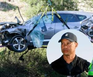 En esta foto del 23 de febrero de 2021, una grúa remueve el auto que conducía Tiger Woods y que se accidente en el suburbio de Rancho Palos Verdes en Los Ángeles. Foto:AP