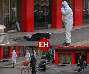 Un hombre cayó muerto en una calle de Wuhan, China. Hombres con trajes protectores lo revisan con una mascarilla facial después de que se desplomara cerca de un hospital. Este jueves las autoridades confirmaron 212 muertos. Fotos AFP