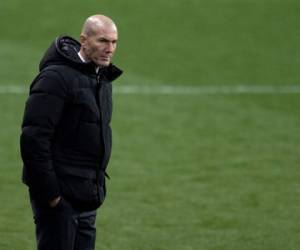(FILES) In this file photo taken on January 14, 2021 Real Madrid's French coach Zinedine Zidane reacts during the Spanish Super Cup semi final football match between Real Madrid and Athletic Club Bilbao at La Rosaleda stadium in Malaga. - Zinedine Zidane has tested positive for Covid-19, the club announced on January 22, 2021. (Photo by JORGE GUERRERO / AFP)
