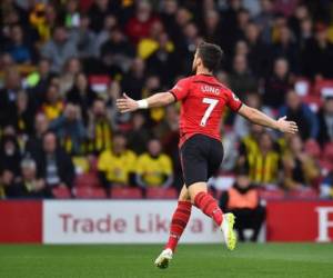 Southampton's Irish striker Shane Long celebrates scoring the opening goal during the English Premier League football match between Watford and Southampton at Vicarage Road Stadium in Watford, north of London on April 23, 2019. (Photo by Glyn KIRK / AFP) / RESTRICTED TO EDITORIAL USE. No use with unauthorized audio, video, data, fixture lists, club/league logos or 'live' services. Online in-match use limited to 120 images. An additional 40 images may be used in extra time. No video emulation. Social media in-match use limited to 120 images. An additional 40 images may be used in extra time. No use in betting publications, games or single club/league/player publications. /