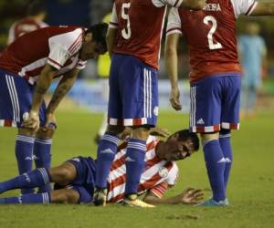 Colombia's Radamel Falcao, 9, controls the ball pressure by Paraguay's Richard Ortiz during a 2018 Russia World Cup qualifying soccer match at the Roberto Melendez stadium in Barranquilla, Colombia, Thursday, Oct. 5, 2017. (AP Photo/Fernando Vergara)