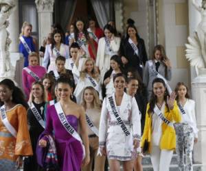 Miss Universe 2018 contestants visit the Government House in Bangkok, Thailand Tuesday, Dec. 11, 2018. (Narong Sangnak/Pool Photo via AP)