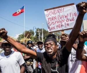 En los últimos meses, miles de manifestantes haitianos salieron a las calles para exigir la salida del fallecido Jovenel Moise. FOTO: AFP