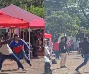 Los militantes de Libre y el Partido Liberal empezaron a lanzar piedras a la carpa donde se encontraban los representantes del Partido Nacional en el CLE.